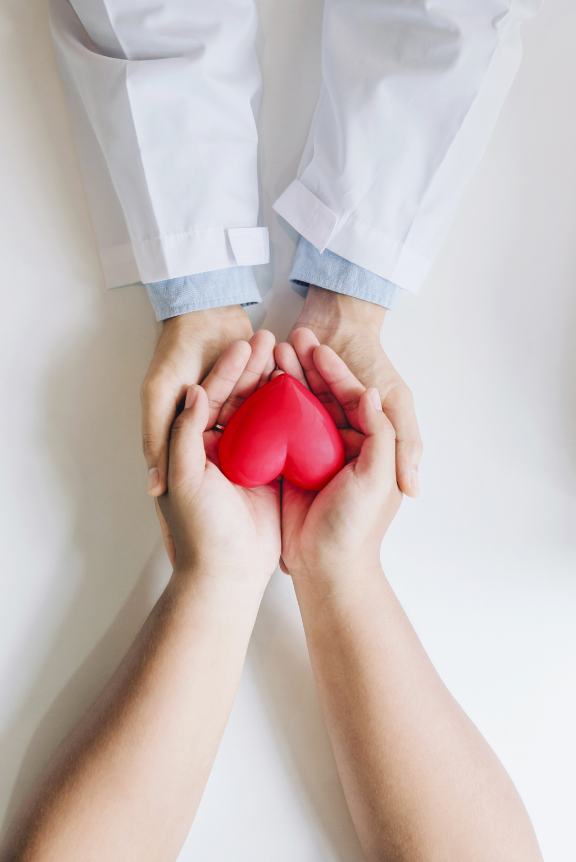 doctor holding patients hands